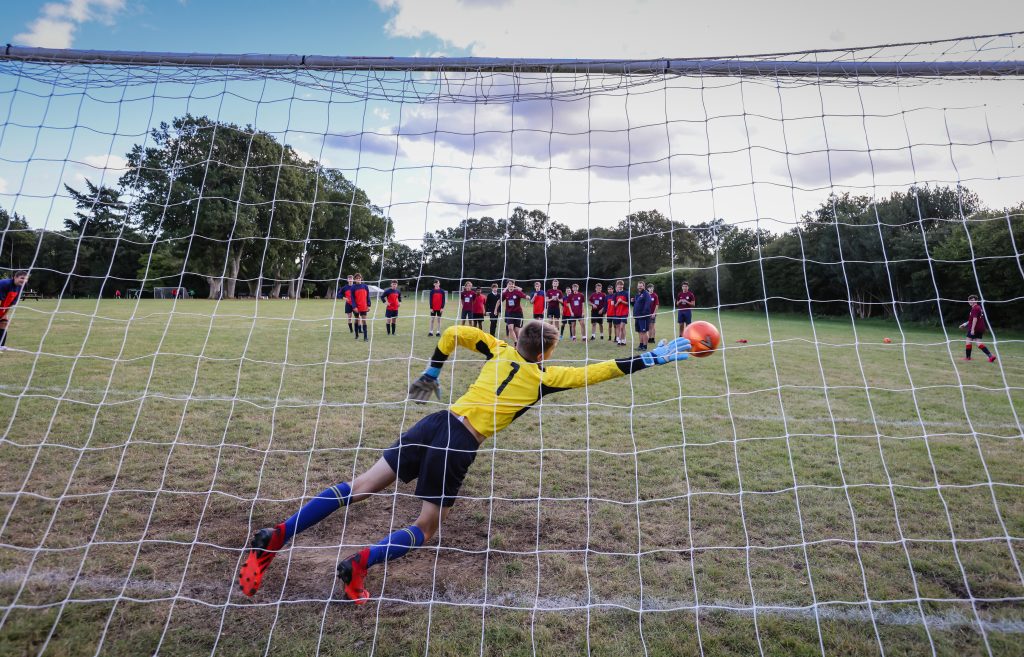 Pupils playing football