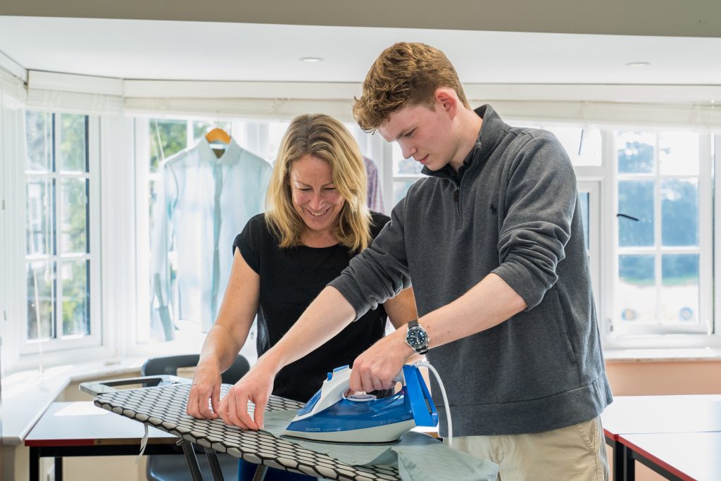 More House School Sixth Form Pupil ironing