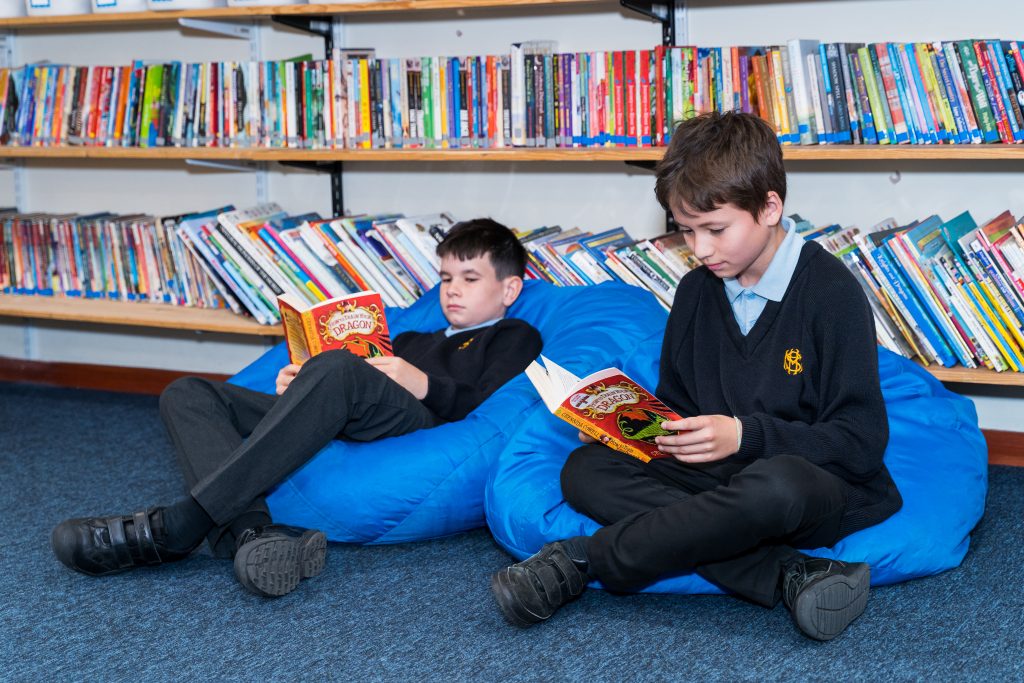 More House School Junior Years pupils reading in the library