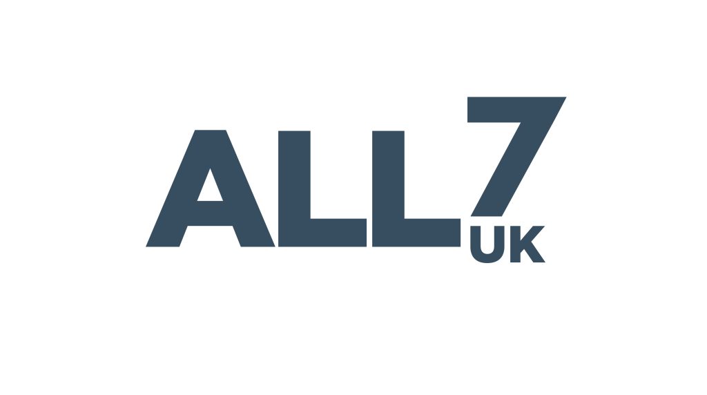 The image displays the text ALL7 UK in bold, dark blue capital letters on a white background, evoking the energy of a Celebrity football Match.